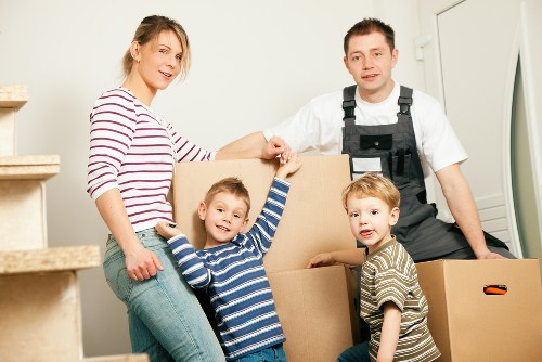 Professional house movers unloading items at a Bayswater home