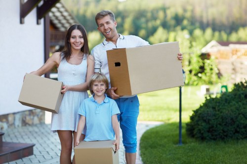 Local moving crew transporting furniture through a Bayswater street